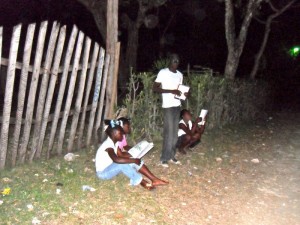 Students studying under street lamps