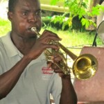 Fanfare musician playing his new trumpet